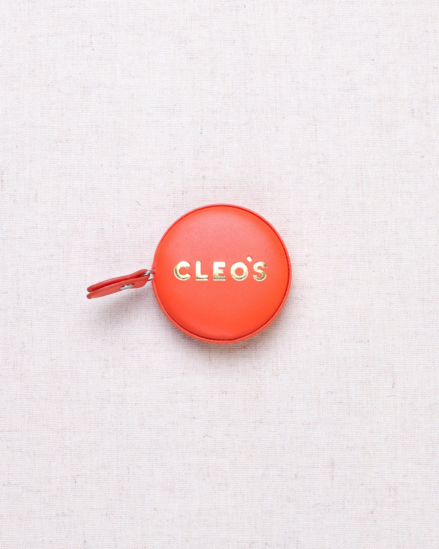 CLEO'S Red-Orange Tape Measure