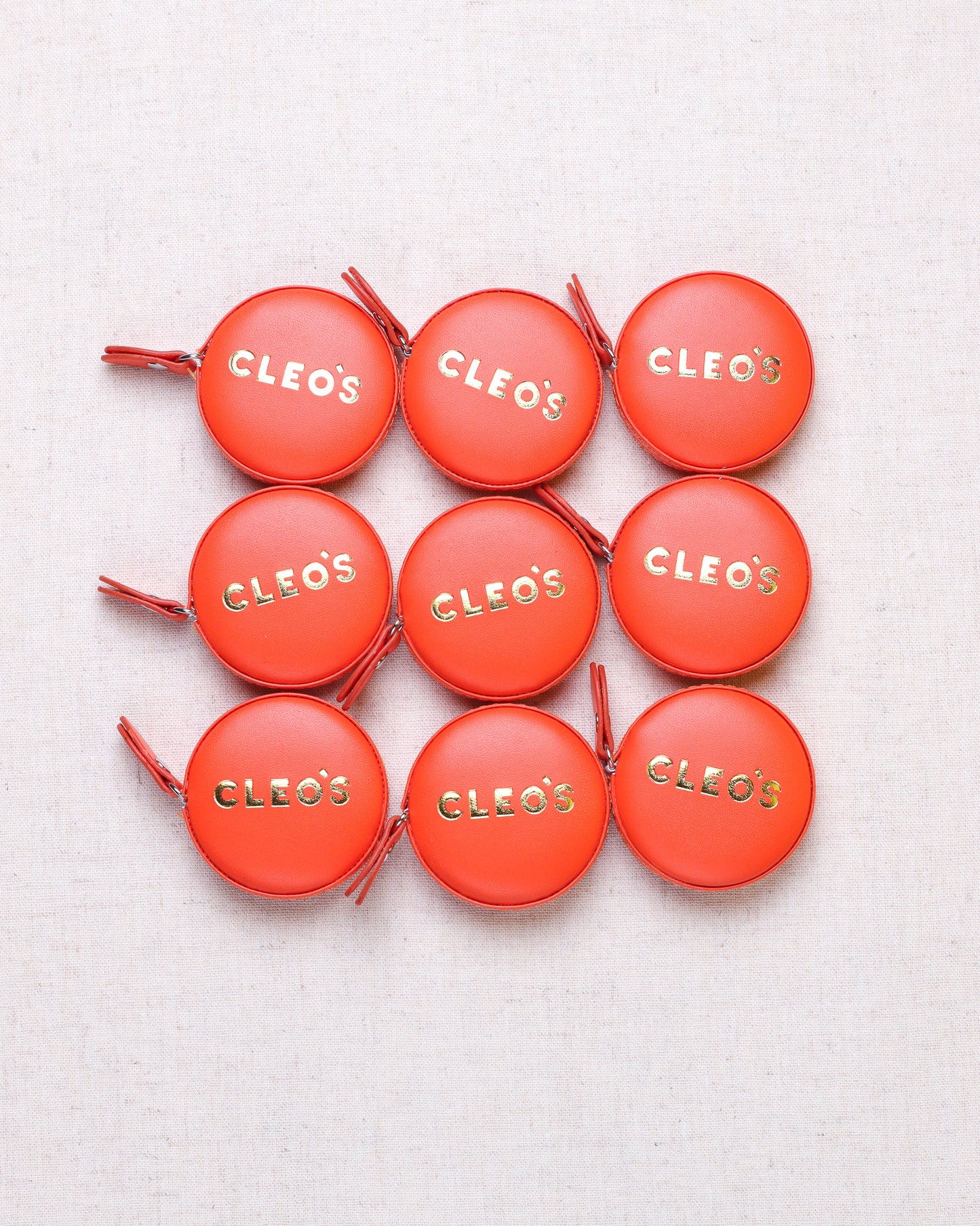 CLEO'S Red-Orange Tape Measure